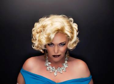 Suzie St James in a blue gown and diamond jewellery